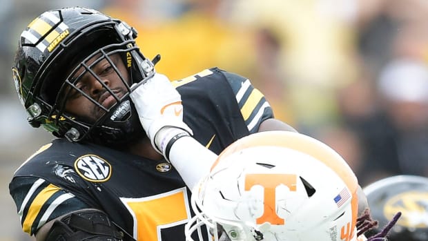 Tennessee defensive lineman Ja'Quain Blakely (48) and Missouri offensive line Hyrin White (50) defend against one another during a game Tennessee and Missouri at Faurot Field in Columbia, Mo. on Saturday, Oct. 2, 2021.