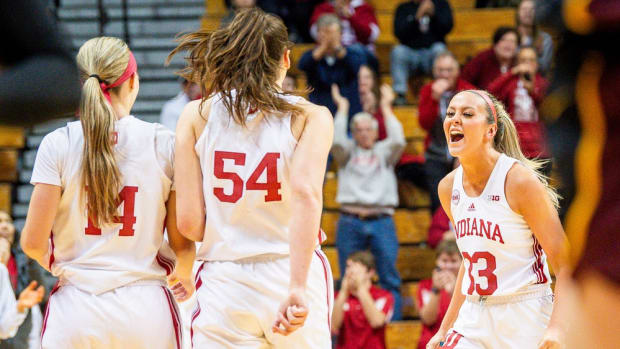 Indiana's Sydney Parrish (33) celebrates with Sara Scalia (14) and Mackenzie Holmes (54) during the first half of the Indiana versus Minnesota wonen's basketball game at Simon Skjodt Assembly Hall on Wednesday, Jan. 17, 2024.