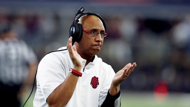 Arkansas Razorbacks wide receivers coach Michael Smith on the sidelines against the Texas A&M Aggies at AT&T Stadium.