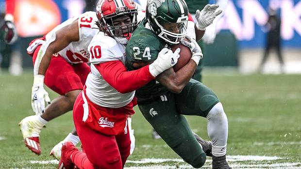Myles Jackson tackles Elijah Collins during Indiana's double-overtime win at Michigan State on Nov. 19, 2022.