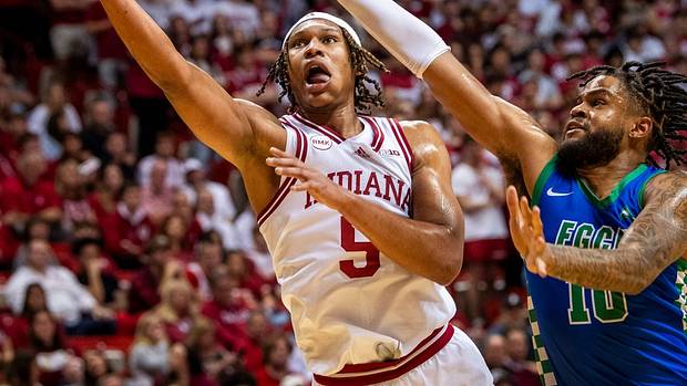 Indiana's Malik Reneau (5) scores past Florida Gulf Coast's Zach Anderson (10) during the second half of the Indiana versus Florida Gulf Coast men's basketball game at Simon Skjodt Assembly Hall on Tuesday, Nov. 7, 2023.