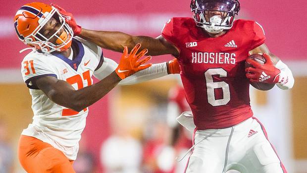 Indiana's Cam Camper (6) stiff arms Illinois' Devon Witherspoon (31) during the Indiana versus Illinois football game at Memorial Stadium on Friday, Sept. 2, 2022.