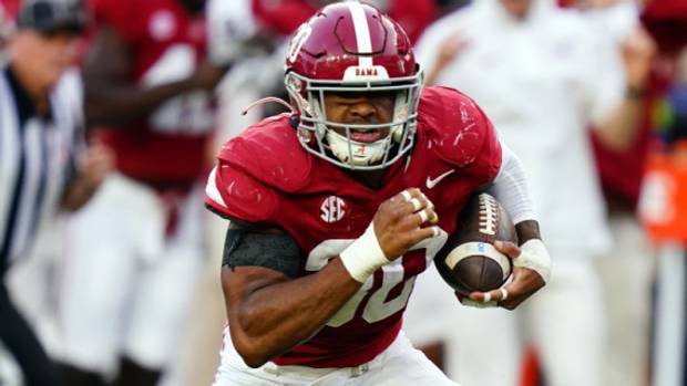 Alabama Crimson Tide linebacker Jihaad Campbell returns a fumble during a college football game in the SEC.