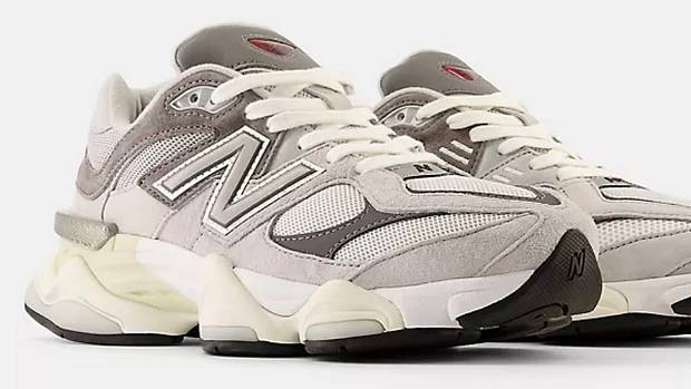 Side view of grey and white New Balance shoes.