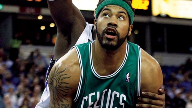 Boston Celtics forward Rasheed Wallace is fouled by Sacramento Kings forward Jason Thompson. Wallace said on his podcast that a hard hit by former Razorback Joe Kleine was his "Welcome to the NBA" moment.