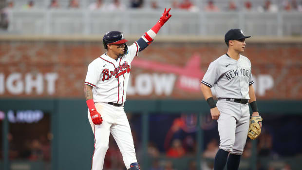 Aug 14, 2023; Atlanta, Georgia, USA; Atlanta Braves shortstop Orlando Arcia (11) reacts after a RBI single against the New York Yankees in the third inning at Truist Park.