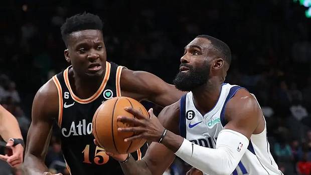 Dallas Mavericks' Tim Hardaway Jr. goes in for a layup against Atlanta Hawks' Clint Capela.