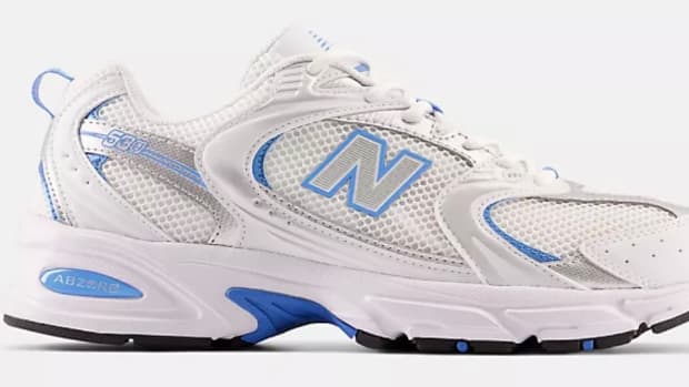 View of white and blue New Balance shoes.