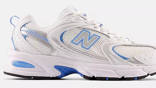 View of white and blue New Balance shoes.