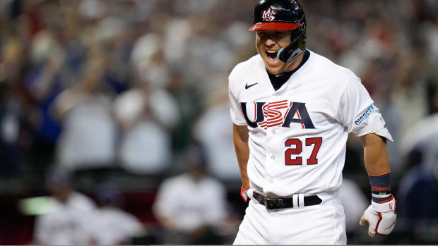 United States’ Mike Trout celebrates his three-run home run against Canada during the first inning of a World Baseball Classic game