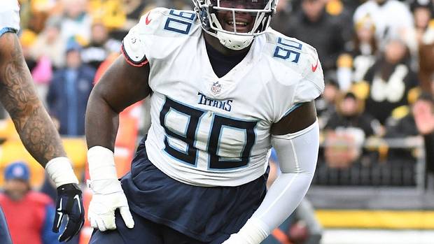 Tennessee Titans defensive tackle Naquan Jones (90) celebrates a sack of Pittsburgh Steelers quarterback Ben Roethlisberger (7) during the first quarter against the Pittsburgh Steelers at Heinz Field.