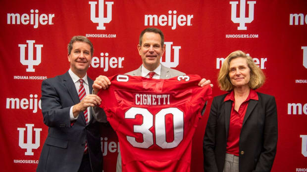 Vice President and Director of Intercollegiate Athletics Scott Dolson, left, Indiana's newly announced head coach of football Curt Cignetti, middle, and Indiana Univeristy President Pamela Whitten pose together on Friday, Dec. 1, 2023. Cignetti is the 30th football coach in the university's history.