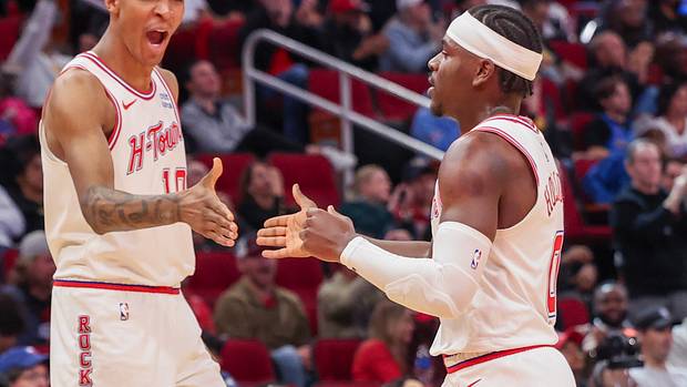 Rockets forward Jabari Smith Jr. reacts a basket by guard Aaron Holiday against the Oklahoma City Thunder in the second half at Toyota Center.