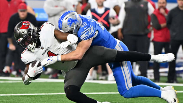 Detroit Lions linebacker Jack Campbell (46) tackles Tampa Bay Buccaneers running back Rachaad White (1) during the first quarter in a 2024 NFC divisional round game at Ford Field. Mandatory Credit: Lon Horwedel-USA TODAY Sports