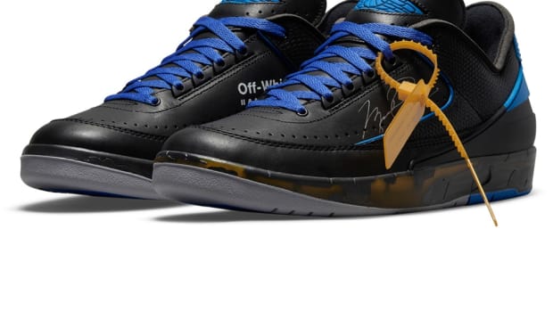Air Jordan 2 Retro Low sneakers 'Off-White Black Blue' colorway.