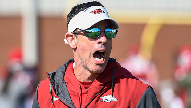 Arkansas offensive coordinator Dan Enos calls out to his players during practice.