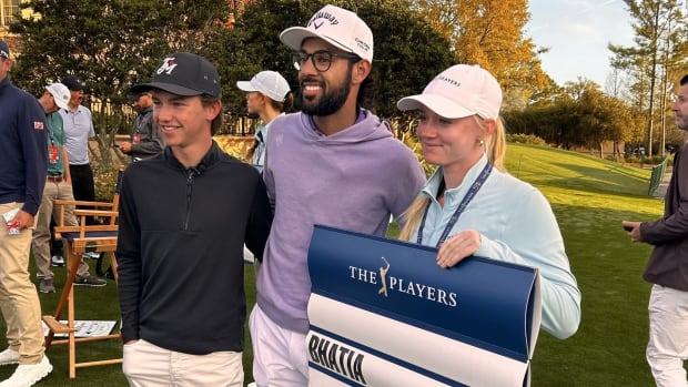 Miles Russell of Jacksonville Beach (left), the 2023 Junior Players Champion, had a busy day at the TPC Sawgrass on Wednesday. He is with PGA Tour player Akshay Bhatia (center) and standard-bearer Nancy Cox, the two-time Times-Union girls high school player of the year.  