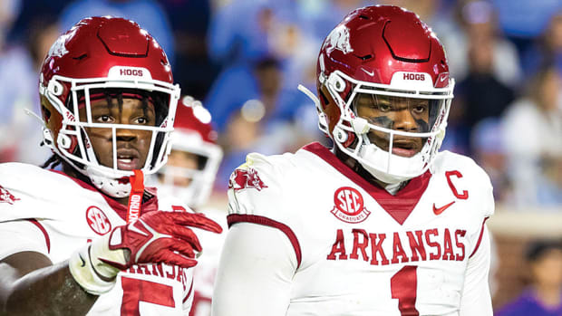 Arkansas quarterback KJ Jefferson and running back Raheim Sanders wait for the call to come in against Ole Miss in Oxford.