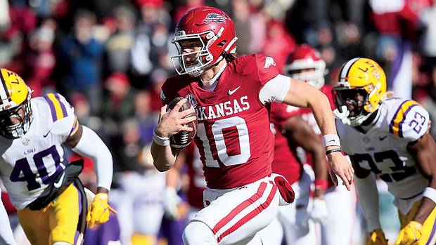 Arkansas quarterback Cade Fortin rushes against the LSU Tigers.