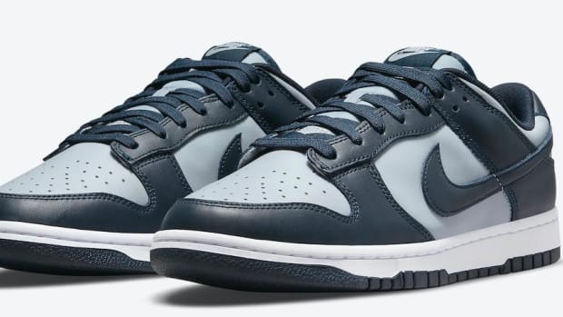 Navy and grey Nike Dunk sneakers.