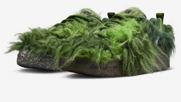 View of furry green Nike shoes.