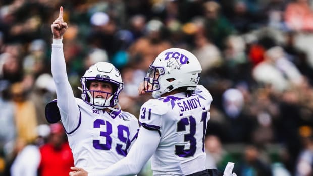 TCU place kicker Griffin Kell celebrates with holder Jordy Sandy after Kell's 40-yard field goal as time expired for TCU to beat Baylor 29-28.