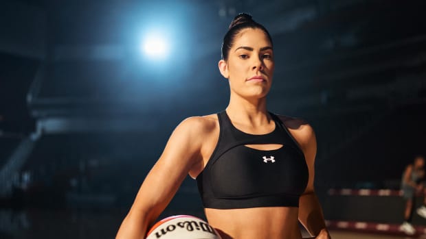 Kelsey Plum poses in Under Armour gear.