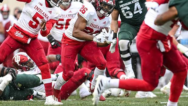 Indiana's Josh Henderson runs for a gain against Michigan State during overtime on Saturday, Nov. 19, 2022, at Spartan Stadium in East Lansing.