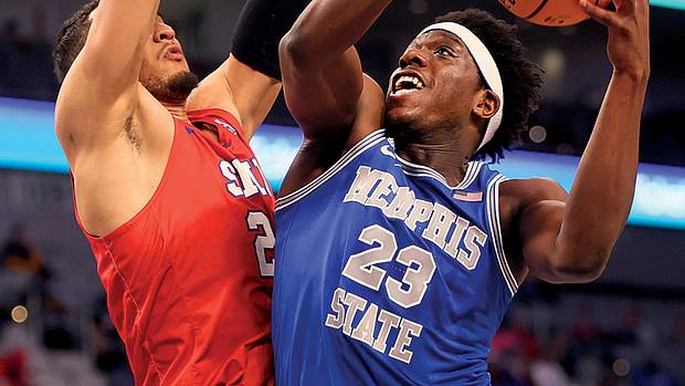 Memphis Tigers forward Malcolm Dandridge shoots the ball over SMU Mustangs forward Isiah Jasey during their AAC Tournament game at Dickies Arena in Fort Worth.