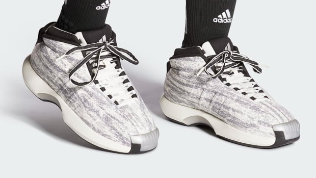 View of white and grey Adidas Crazy 1 shoes.
