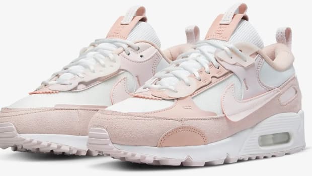 View of pink and white Nike shoes.