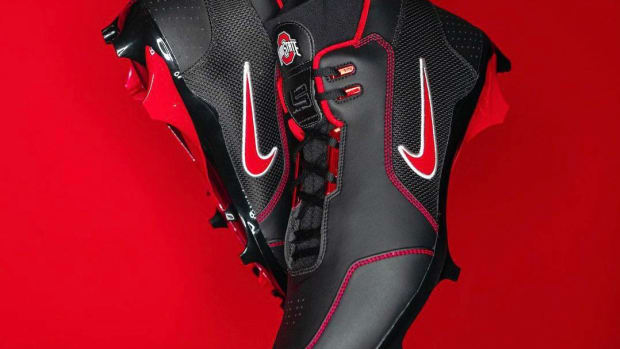 View of black and red Nike cleats.