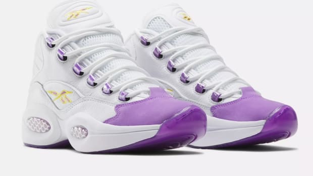 Side view of Kobe Bryant's purple and white Reebok sneakers.