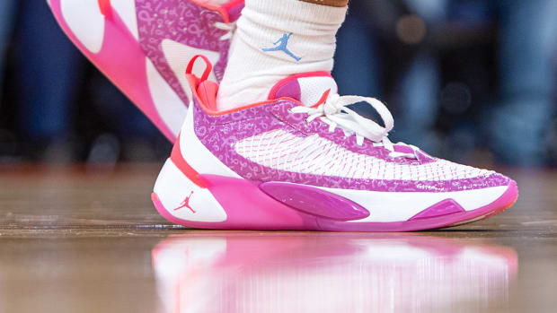 View of pink and white Jordan Luka shoes.