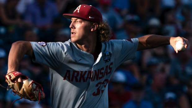 Razorbacks starting pitcher Hagen Smith (33) pitches against Ole Miss during the fourth inning at Charles Schwab Field.
