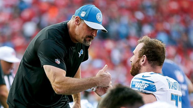 Detroit Lions head coach Dan Campbell shakes hand with center Frank Ragnow during warm up ahead of the season opener against the Kansas City Chiefs at Arrowhead Stadium in Kansas City.