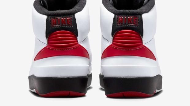 Rear view of white, red, and black Jordan shoes.