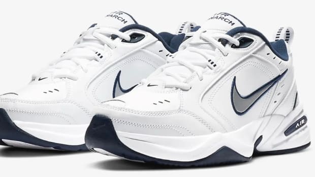 View of white and navy Nike shoes.