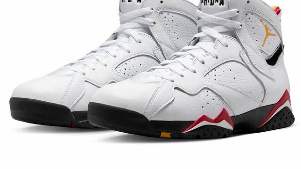 View of white and navy Air Jordan shoes.
