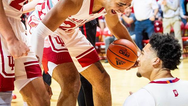 Race Thompson (25) and Trayce Jackson-Davis (23) congratulate Jalen Hood-Schifino (1) for a basket and getting fouled during their matchup with Rutgers.
