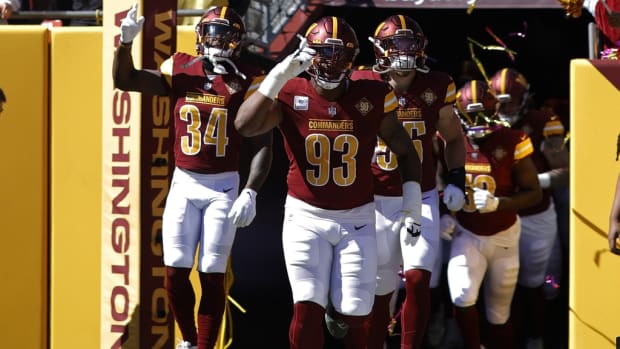 Washington Commanders defensive tackle Jonathan Allen (93) leads teammates out of the tunnel onto the field prior to their game against the Tennessee Titans at FedExField.