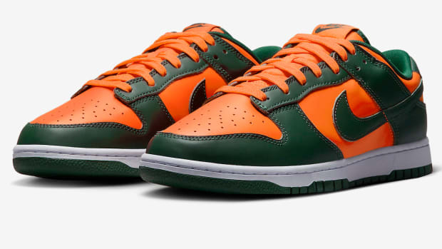 Green and orange Nike Dunk shoes.