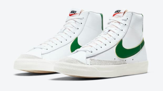 White and green Nike Blazer shoes.