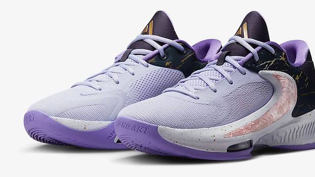 View of purple and black Nike Zoom Freak shoes.
