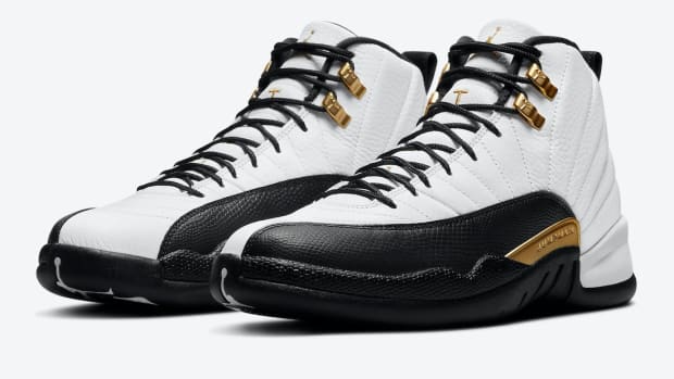 Side view of white and black Air Jordan sneakers.