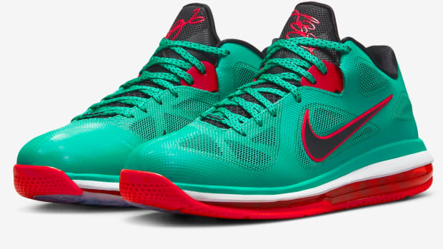 Side view of LeBron James' green and red Nike shoes.