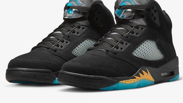 View of black and aqua Air Jordan shoes.
