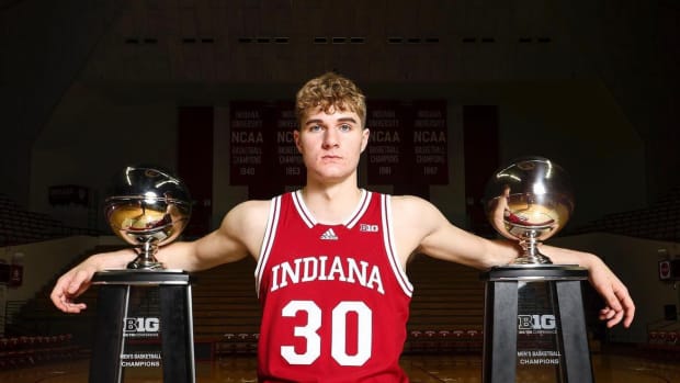 Indiana class of 2024 commit Liam McNeeley poses with Big Ten conference trophies during his official visit to Bloomington in September.