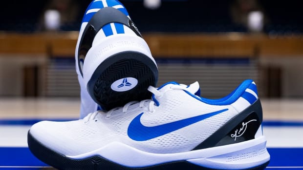 Side view of Duke's white and blue Nike Kobe sneakers.