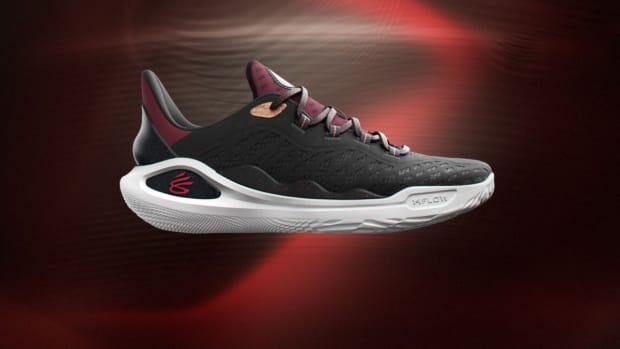 Side view of Stephen Curry's black, red, and white basketball sneakers.